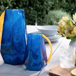 large and small resin pitcher in cobalt and marigold